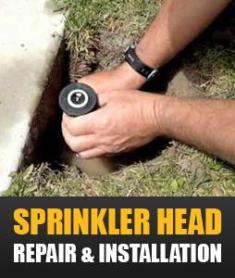 a contractor is changing a sprinkler head